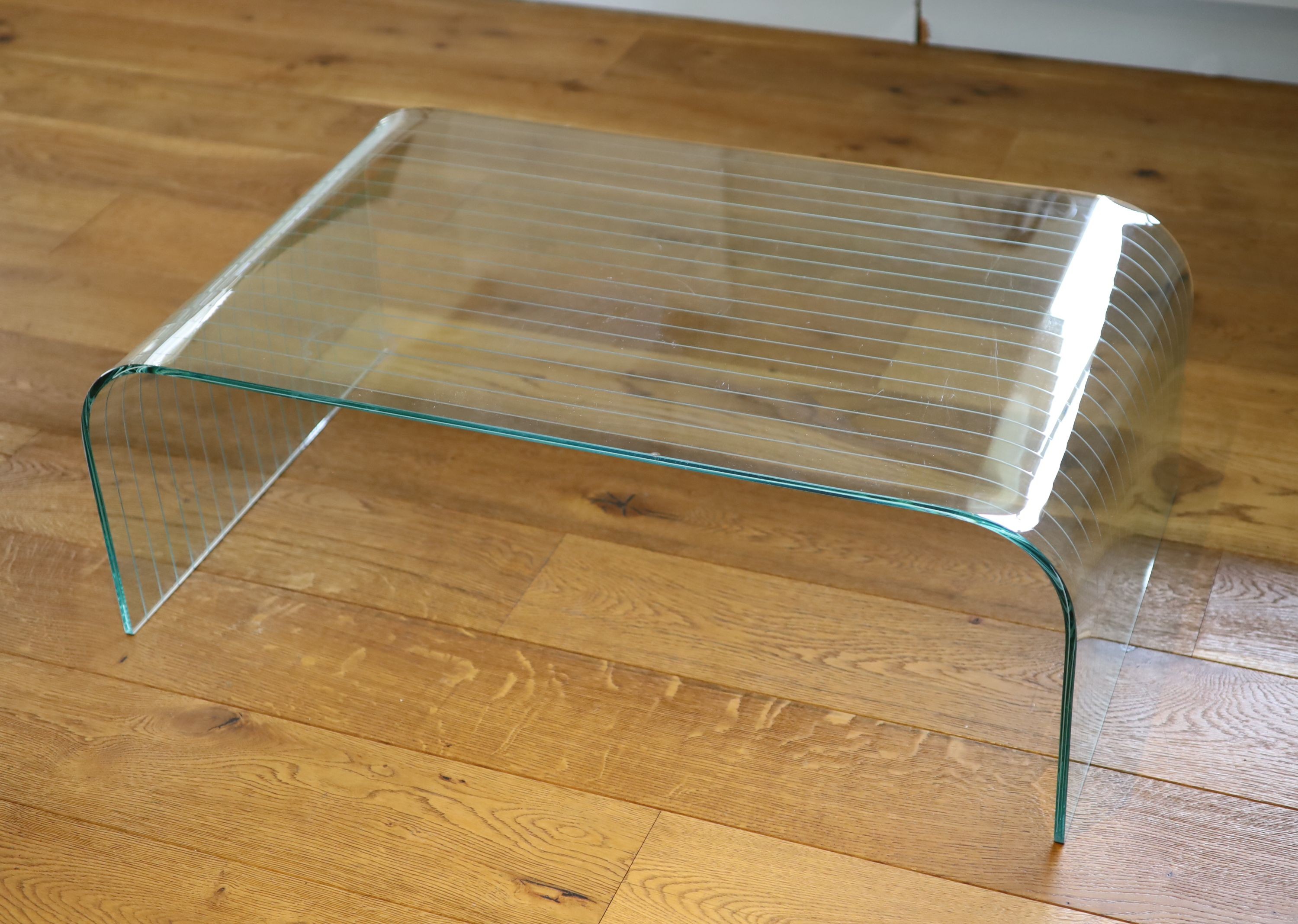 A ribbed glass waterfall coffee table, width 101cm depth 60cm height 36cm